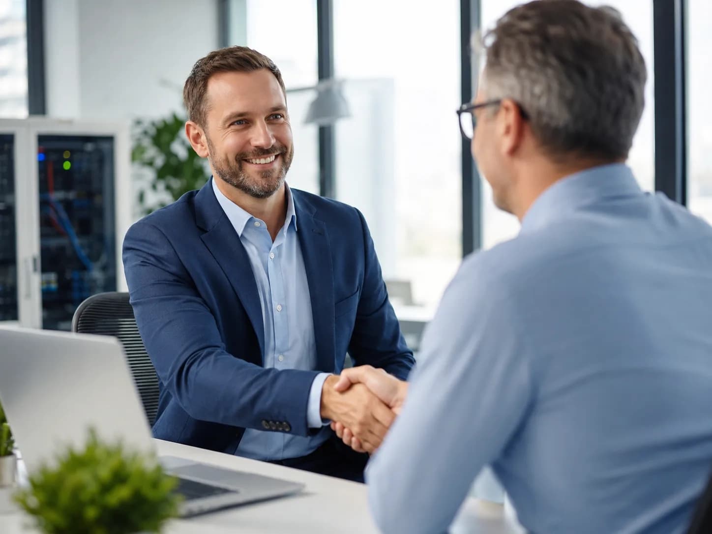 IT consultant shaking hands with a business owner